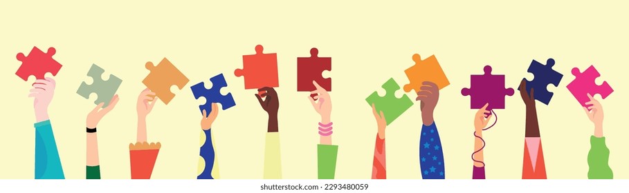 Many hands with pieces of jigsaw puzzle on beige background