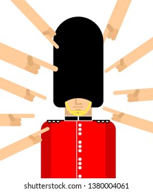 Many hands pointing with their finger British guardsman. Unruffled London Queens guard In fur bear hat. English military in beefeater 