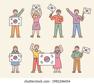 Many people are holding Taegeukgi. flat design style minimal vector illustration.