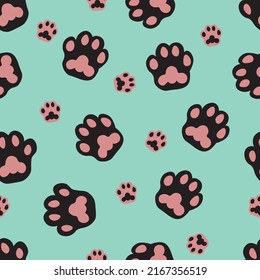 Many prints of cat paws on color background. Texture for design