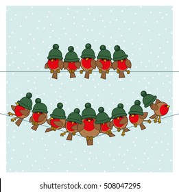 Many Robin Red Breasts wearing Green Woolly Bobble Hats sitting on a couple of Telephone Wires with Snowing Background
