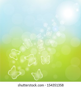 Many transparent butterflies flying over abstract blurred background 