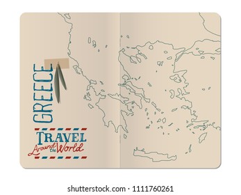 Map of Greece drawn by hand in an open stapled travel notebook and olive leaves with masking tape