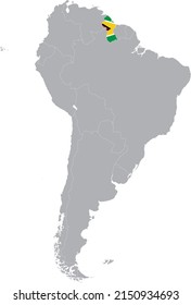 Map of Guyana with national flag within the gray map of South American continent