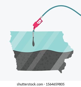 Map Iowa, in USA, being fueled by oil. Gas pump fueled map. On the map there is glass reflection. American state. Conceptual. Oil producing or importing regions.