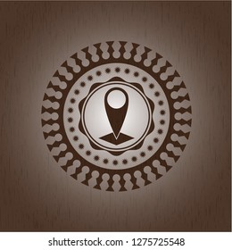 map pointer icon inside badge with wood background