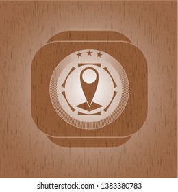 map pointer icon inside retro style wood emblem