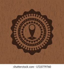 map pointer icon inside retro wooden emblem. 
