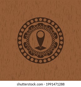 map pointer icon inside retro wooden emblem. 