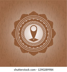 map pointer icon inside vintage wood emblem