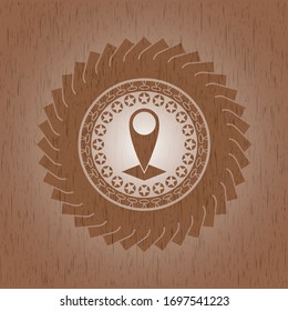 map pointer icon inside wood badge or emblem