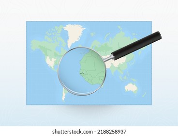 Map of the World with a magnifying glass aimed at Gambia, searching Gambia with loupe. Vector map.