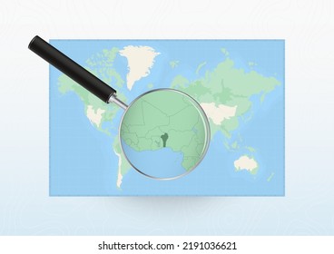 Map of the World with a magnifying glass aimed at Benin, searching Benin with loupe. Vector map.