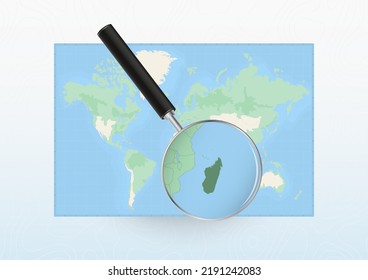 Map of the World with a magnifying glass aimed at Madagascar, searching Madagascar with loupe. Vector map.