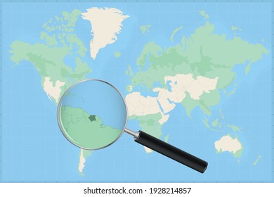 Map of the world with a magnifying glass on a map of Suriname Detailed map of Suriname and neighboring countries in the magnifying glass.