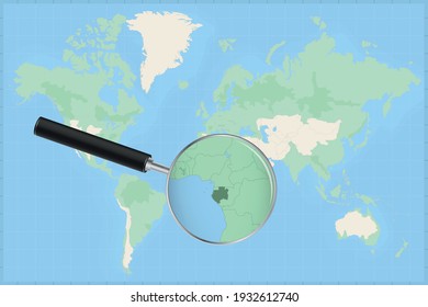 Map of the world with a magnifying glass on a map of Gabon Detailed map of Gabon and neighboring countries in the magnifying glass.