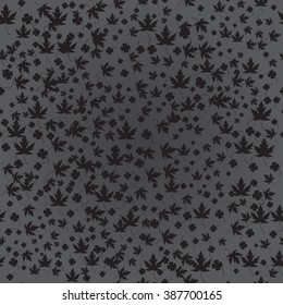 Maple and clover leaves on the dark night. Seamless texture. Spring leaves texture.