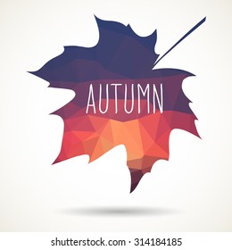 Maple leaf in triangular style with hand drawn word 'Autumn'.