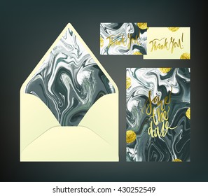 Marble textured wedding print set. Invitation cards and envelope vector templates with black and white green liquid acrylic drips. Hand written glitter gold blots and calligraphy elements.