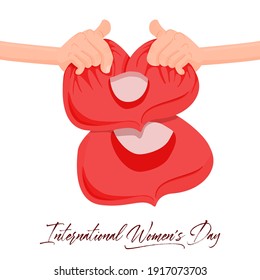 March 8 is international women's day. Hands holding number eight in the shape of heart pillows