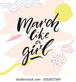 March like a girl. Inspirational feminism quote for printed tee, apparel and posters. Brush calligraphy on pastel pink abstract texture
