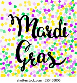 Mardi Gras confetti background. Golden, purple and green confetti for Mardi Gras.