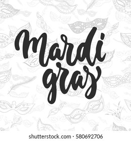 Mardi Gras - hand drawn carnival lettering phrase isolated on the white background. Fun brush ink inscription for photo overlays, greeting card or t-shirt print, poster design