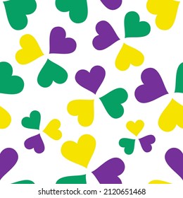 El Mardi Gras es un patrón impecable. Resumen repitiendo el fondo con corazones verdes, amarillos y violetas. Afiche de feriado vectorial