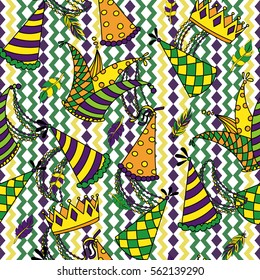 Mardi Gras seamless pattern. Colorful background with carnival hats and jester's hat, crowns, feathers, beads and ribbons. Vector illustration