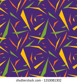 Mardi Gras seamless pattern with splinters / fragments. Abstract geometric background in yellow, green and purple colors. Good for holiday greeting cards, wallpaper, pattern fills, web page background
