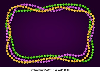 Mardi gras traditional necklaces on a dark purple background.