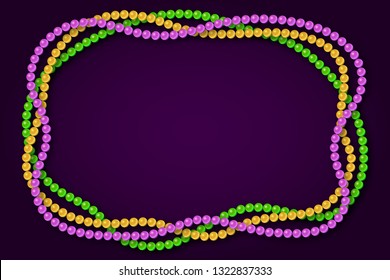 Mardi gras traditional necklaces on a dark purple background.