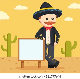 mariachi with sign and desert background