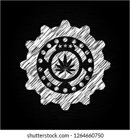 marijuana leaf icon drawn on blackboard