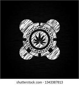 marijuana leaf icon drawn on a chalkboard