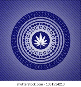 marijuana leaf icon inside badge with denim background