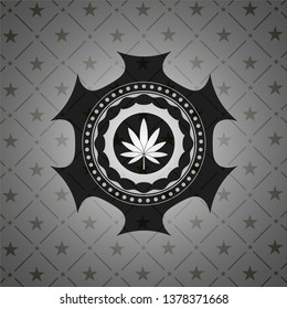 marijuana leaf icon inside black emblem