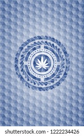 marijuana leaf icon inside blue emblem with geometric background.