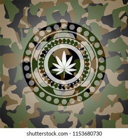 marijuana leaf icon inside camo emblem