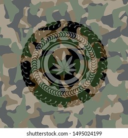 marijuana leaf icon inside camo emblem