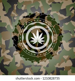 marijuana leaf icon inside camouflage emblem