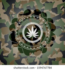 marijuana leaf icon inside camouflage emblem