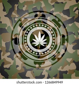 marijuana leaf icon inside camouflaged emblem