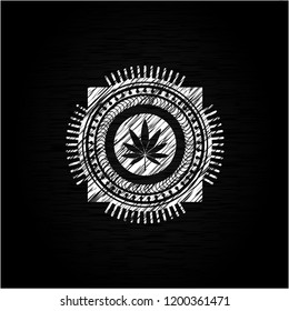 marijuana leaf icon inside chalkboard emblem