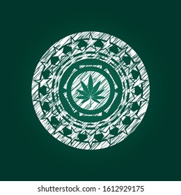 marijuana leaf icon inside chalkboard emblem on black board