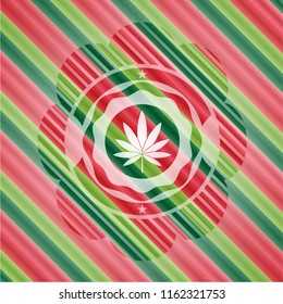 marijuana leaf icon inside christmas colors style emblem.