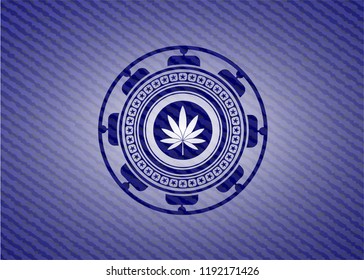 marijuana leaf icon inside emblem with jean texture