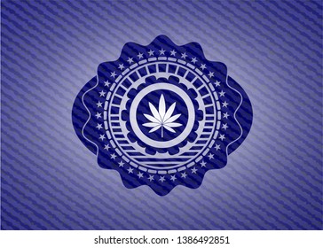 marijuana leaf icon inside emblem with denim texture