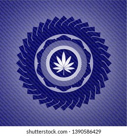 marijuana leaf icon inside emblem with denim high quality background
