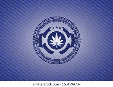 marijuana leaf icon inside emblem with jean background